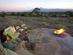 20210909225530 Tortilis Camp   accommodation   main areas   sundowners by the camp fire (c) Silverless